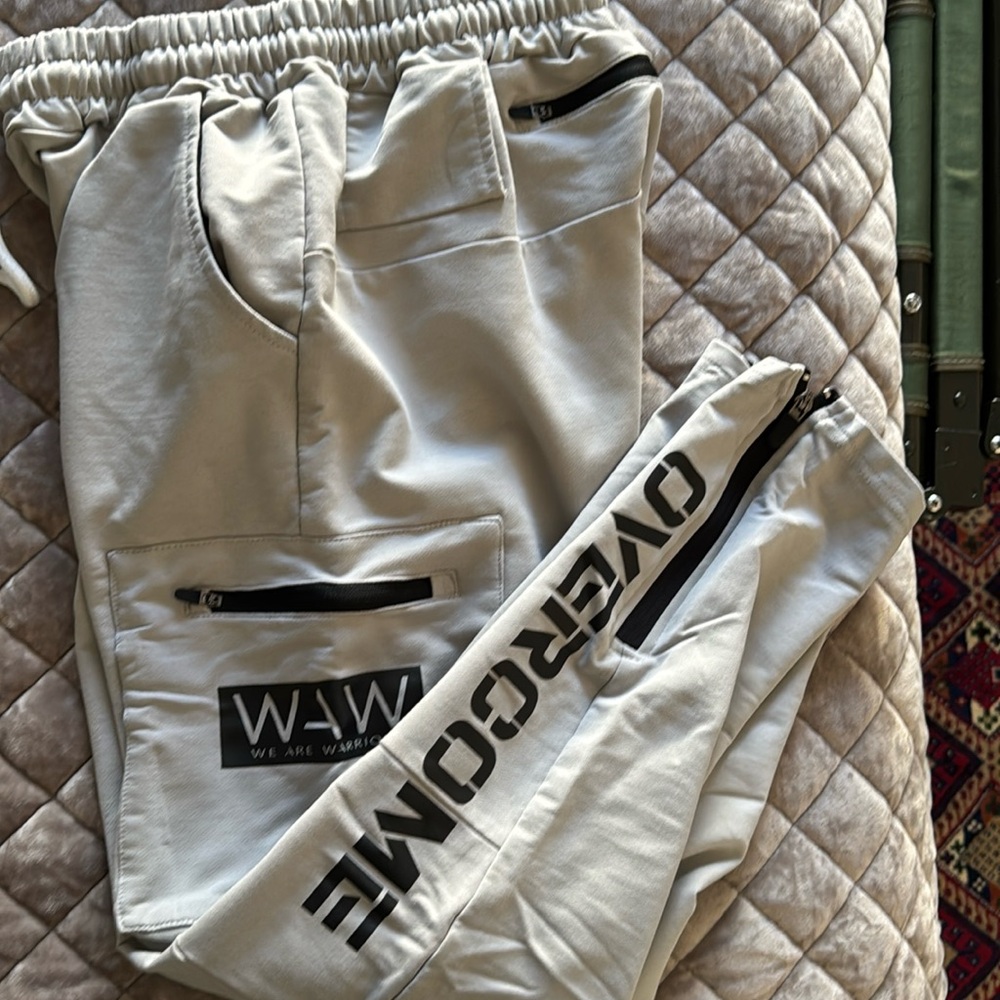 We Are Warriors Overcome Gray joggers Size XL run small